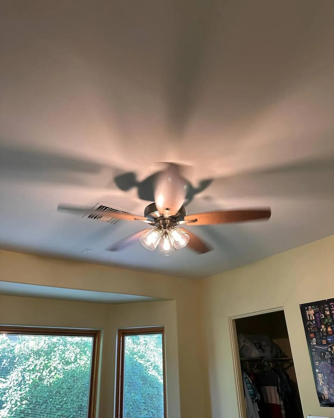 Five-blade wood ceiling fan with a light kit
