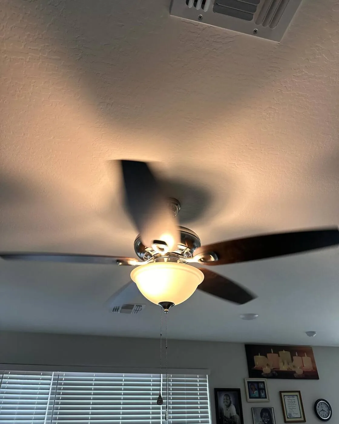 Brushed nickel ceiling fan with a bowl light
