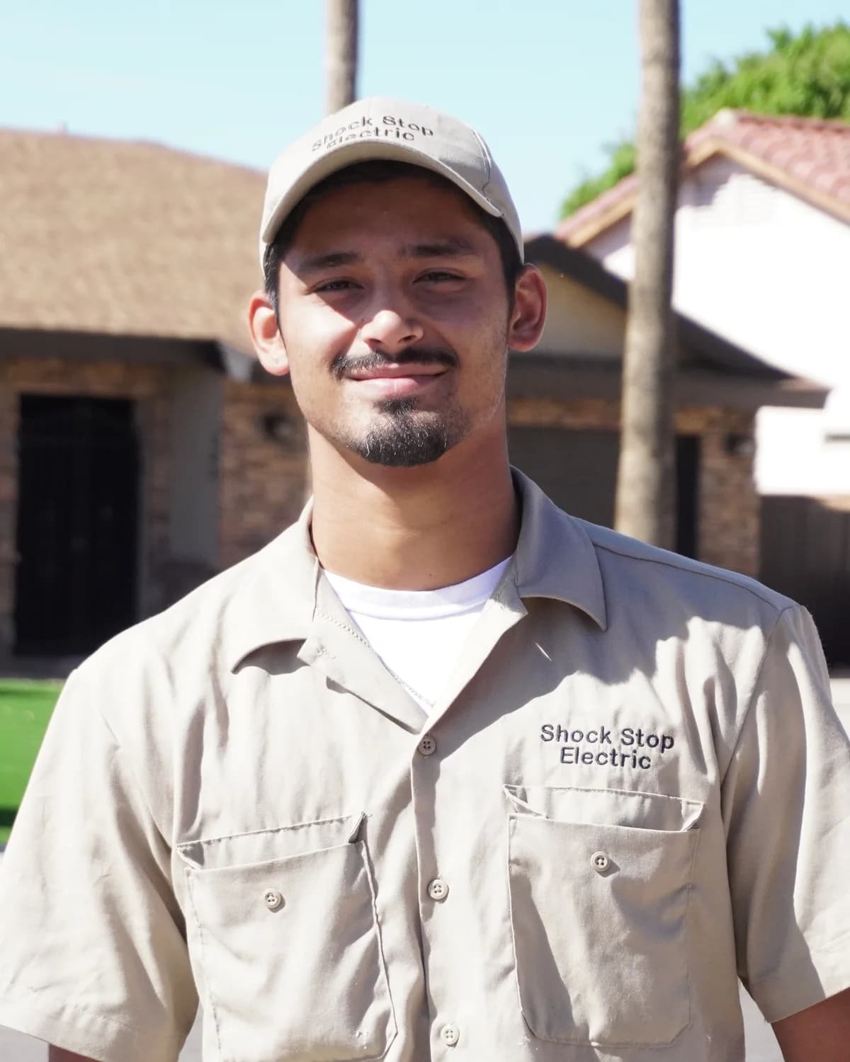 Jason Bottorff outside a Phoenix home in his Shock Stop Electric work shirt